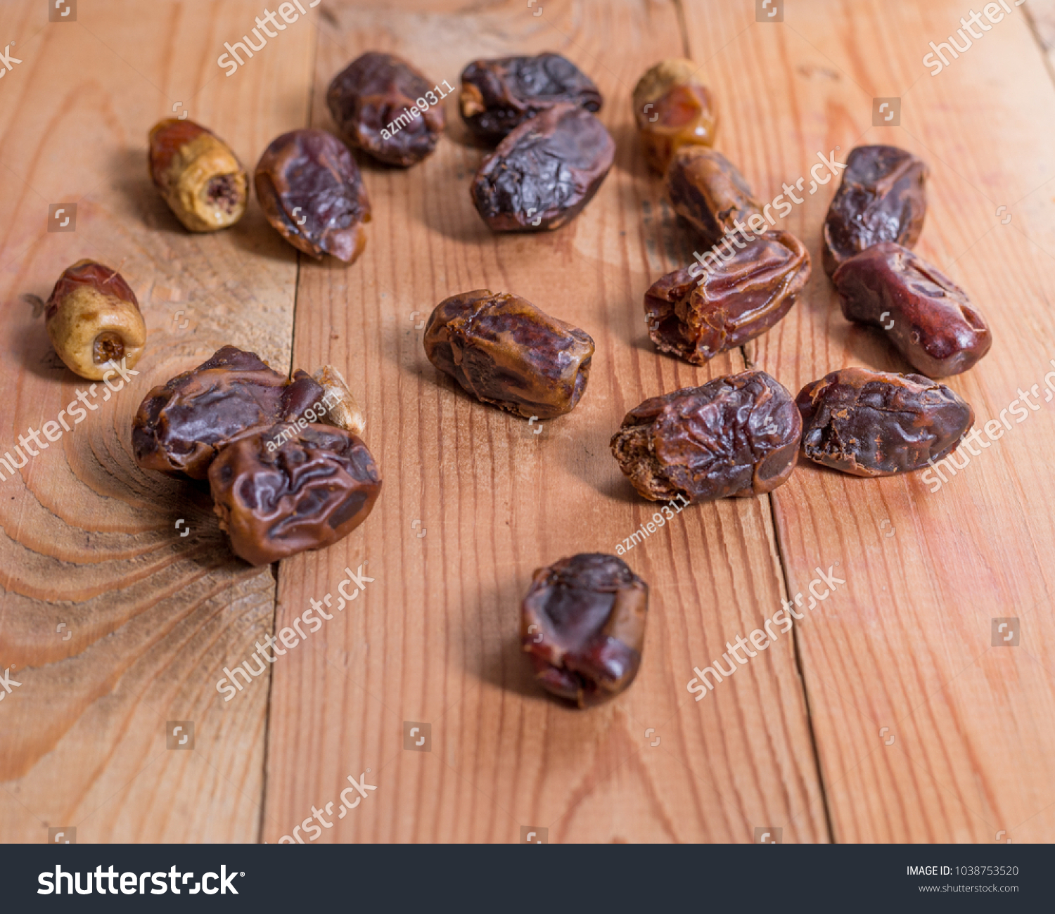 dates fruits on the wooden table #1038753520