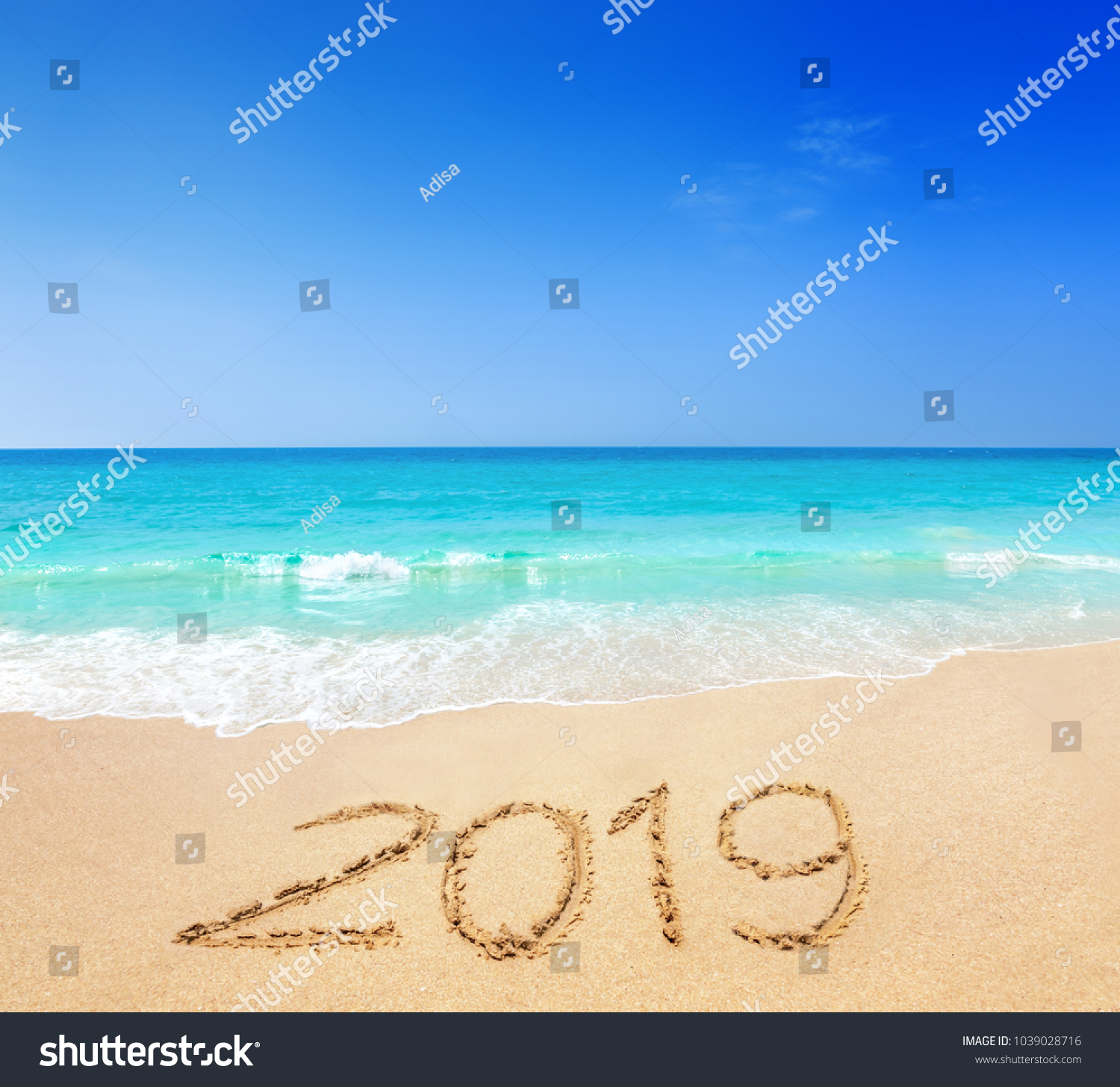 2019 written on sandy beach #1039028716