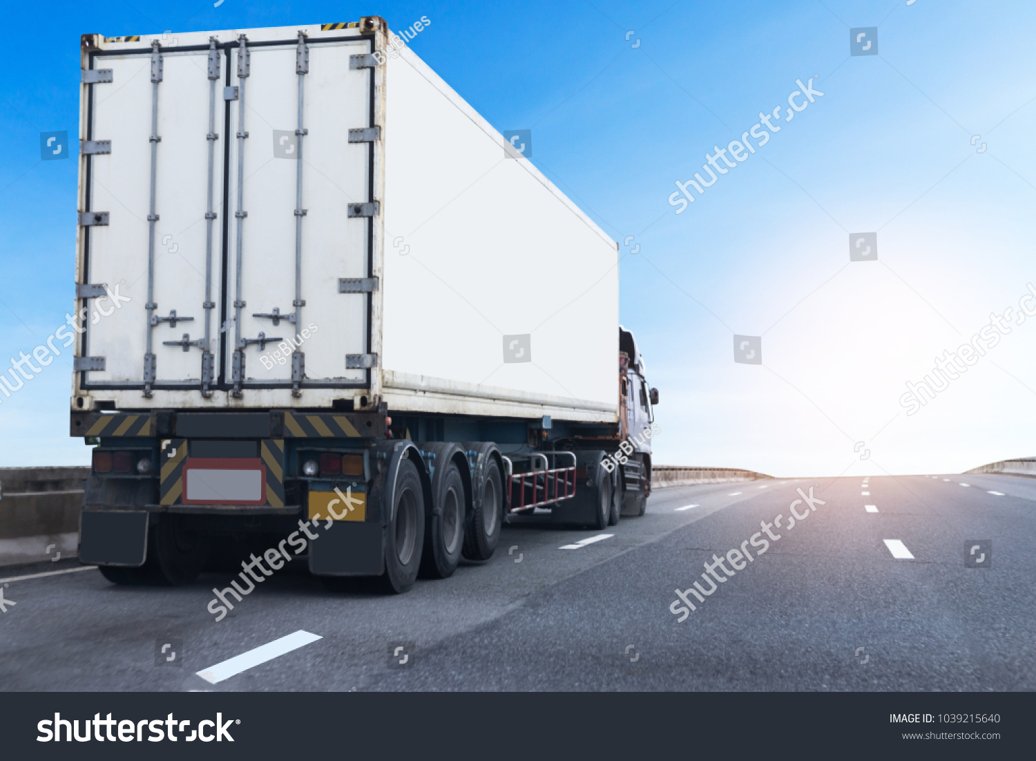 White Truck on highway road with  container, transportation concept.,import,export logistic industrial Transporting Land transport on the asphalt expressway #1039215640