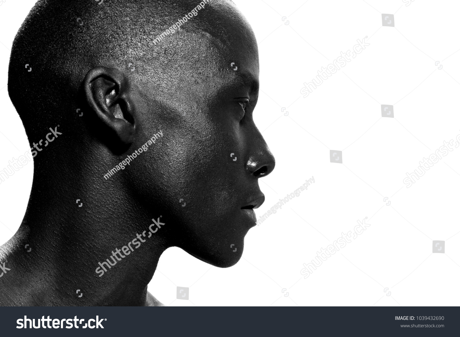 Close up side portrait of african american man staring #1039432690