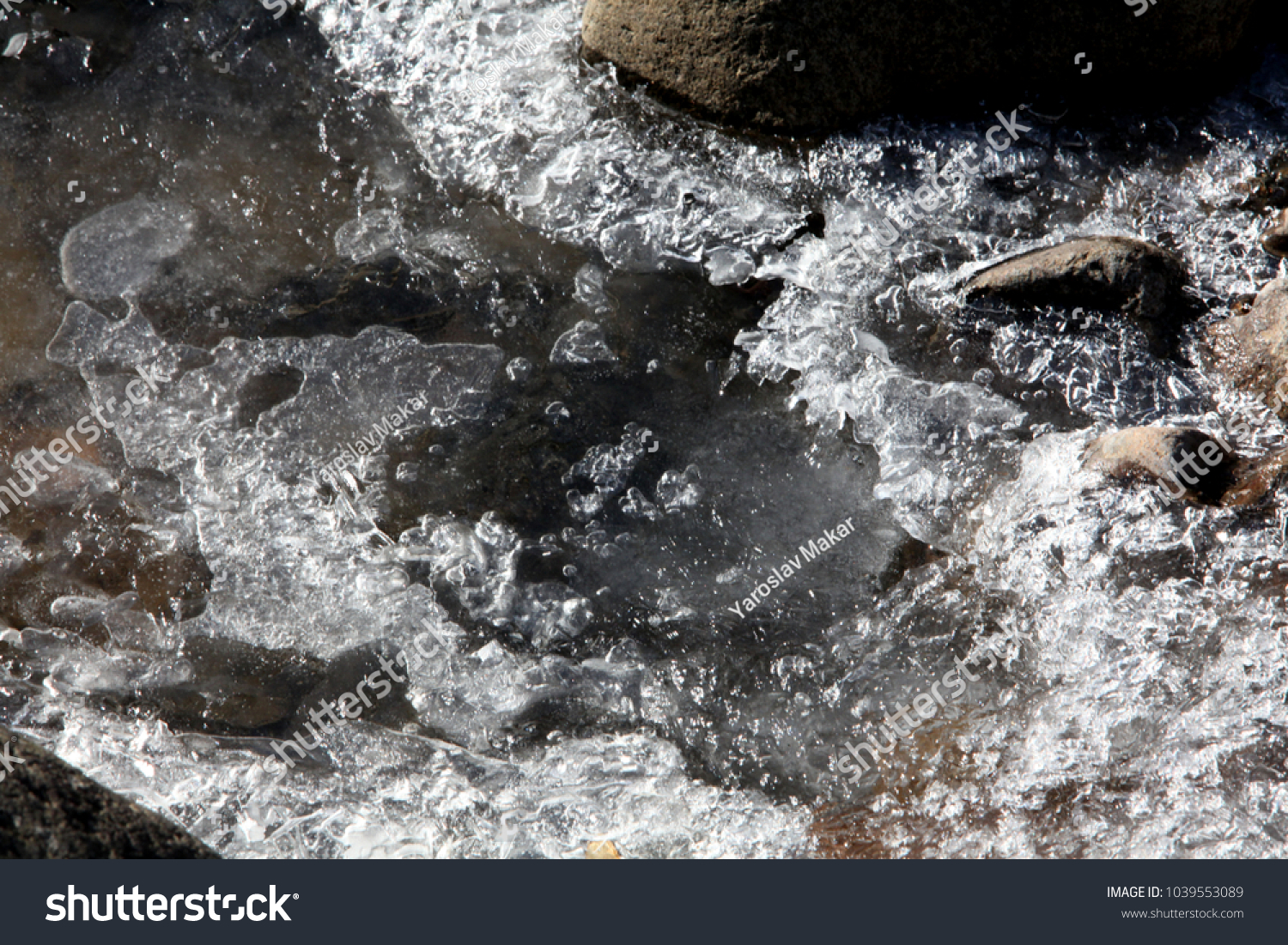 beautiful patterns of frozen ice on rivers #1039553089