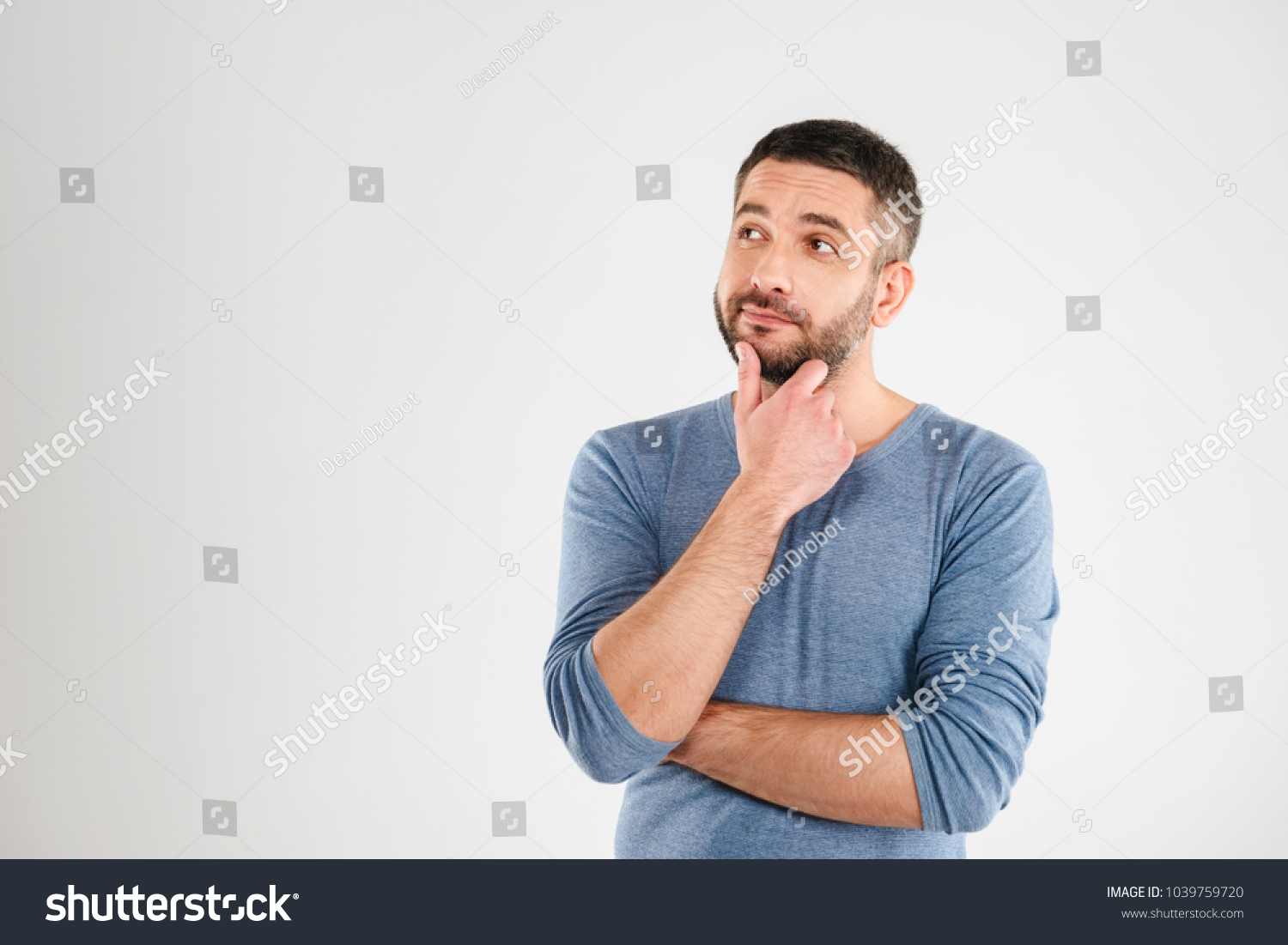 Photo of thoughtful man isolated over white background wall. Looking aside. #1039759720