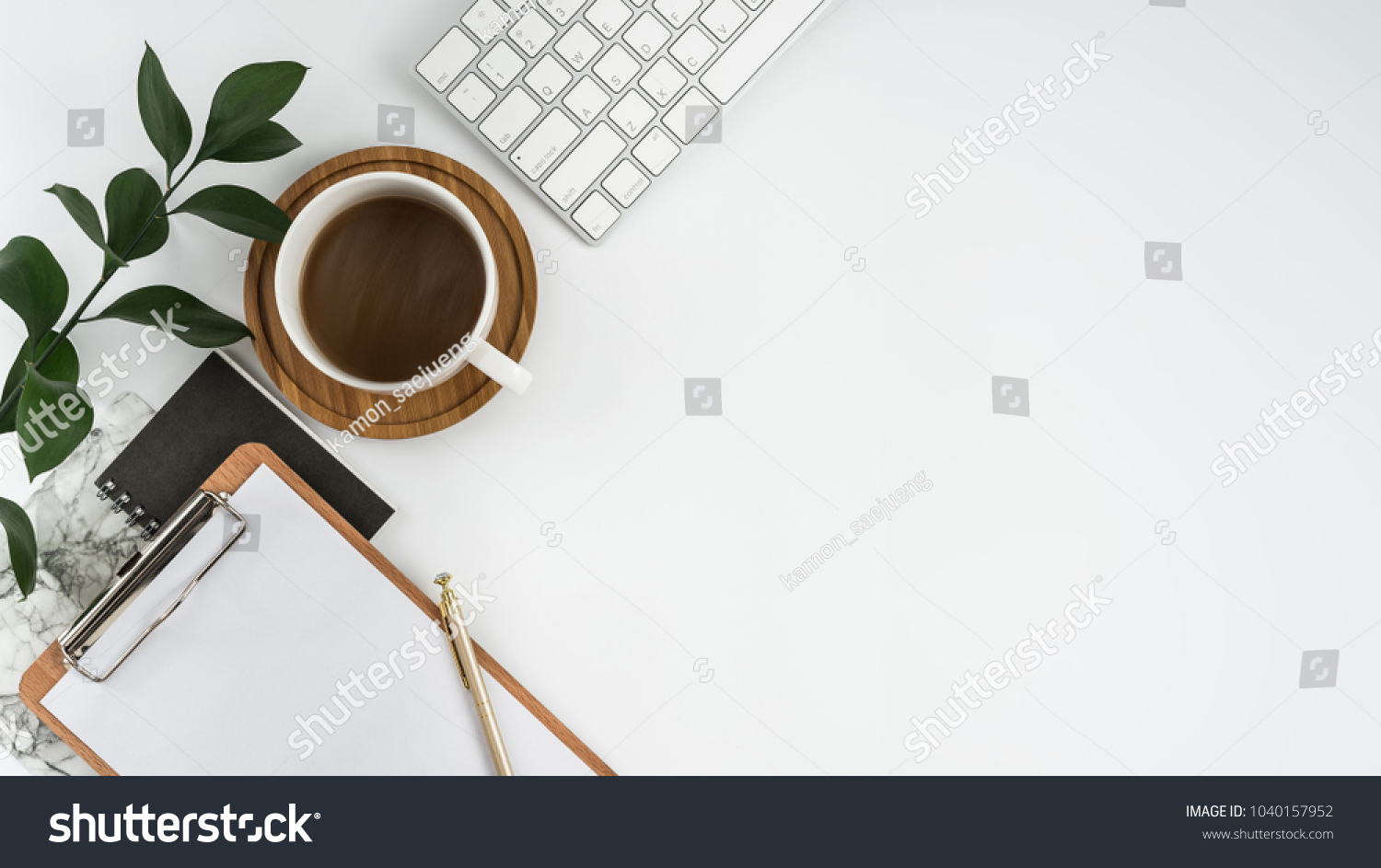 Styled stock photography white office desk table with blank notebook, computer, supplies and coffee cup. Top view with copy space. Flat lay. #1040157952