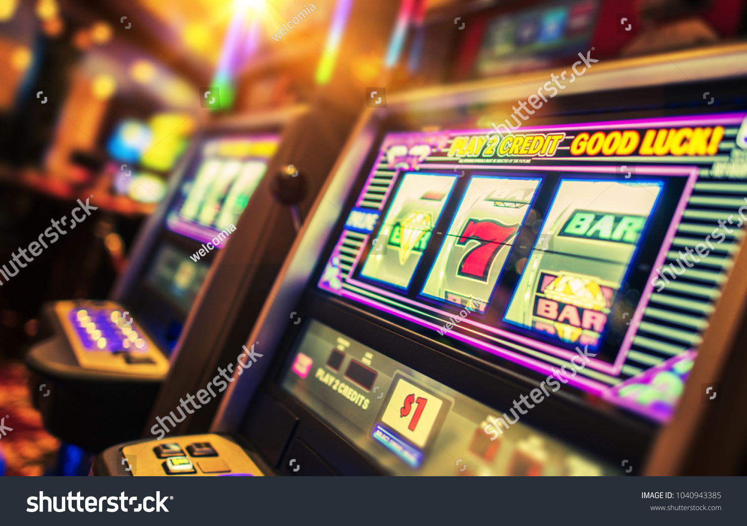 Casino Interior and Row of Classic Slot Machines. Las Vegas Gambling Theme. #1040943385