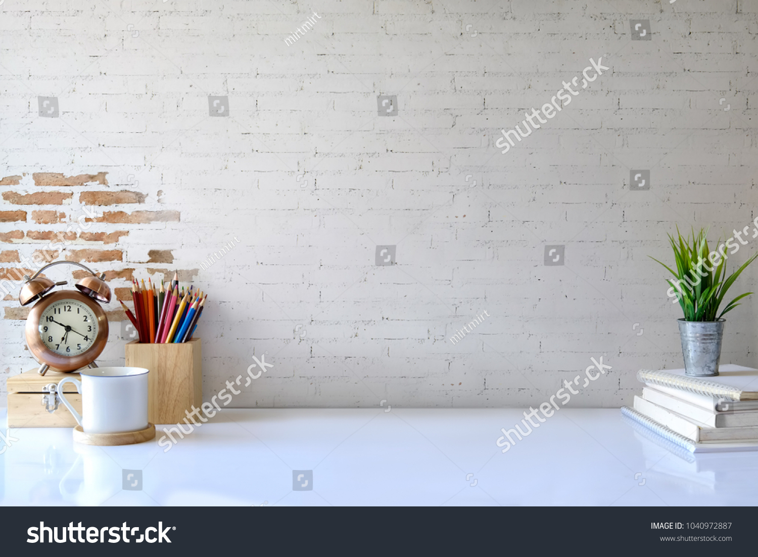 White desk table with copy space, supplies and coffee mug. Front view workspace and copy space #1040972887