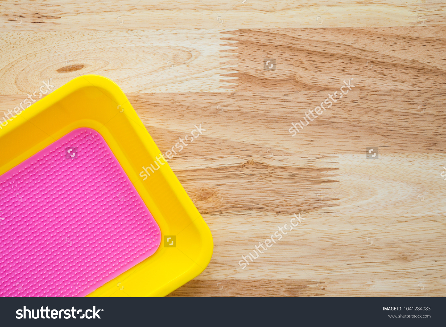 Empty colorful coin tray on wooden table - Small business concept #1041284083