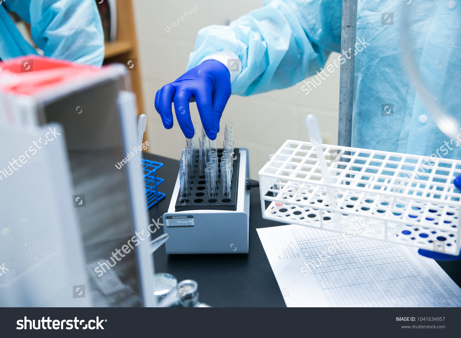 Working in Laboratory with Blue Gloves Healthcare #1041634957