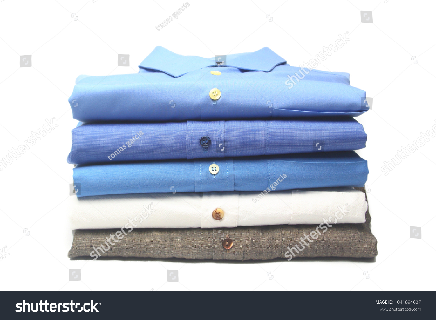 shirt folded and ironed in the dry cleaners #1041894637