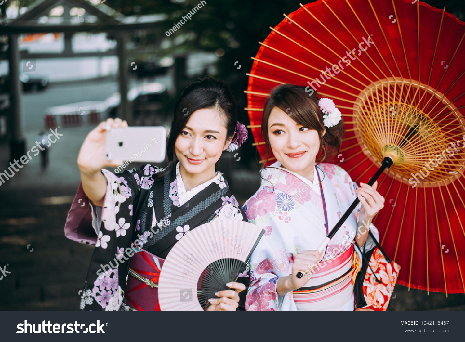 Two japanese girls wearing kimonos traditional clothes, lifestyle moments #1042118467
