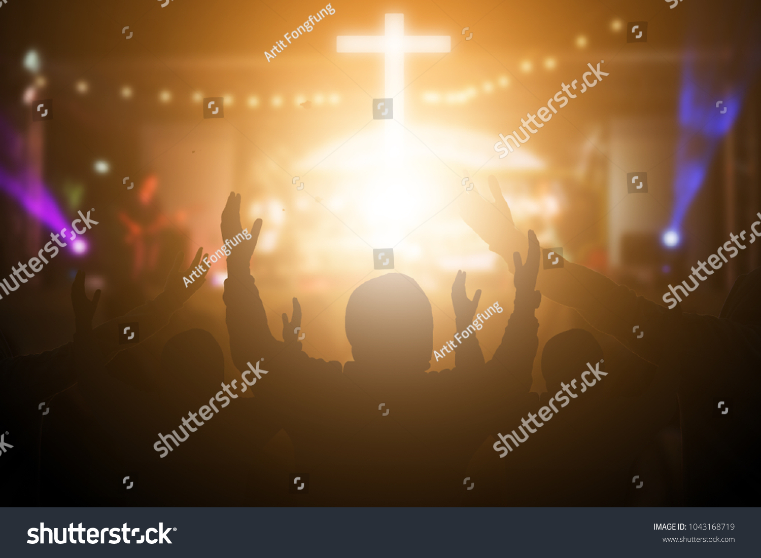 Christians raising their hands in praise and worship at a night music concert. Eucharist Therapy Bless God Helping Repent Catholic Easter Lent Mind Pray. Christian concept background. #1043168719