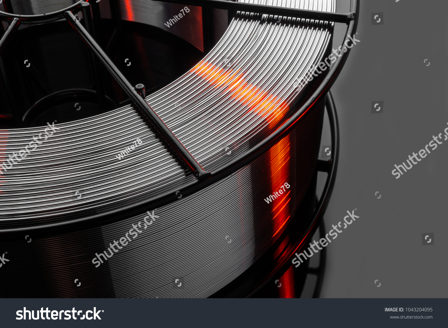 welding wire, stainless steel, on a black background #1043204095