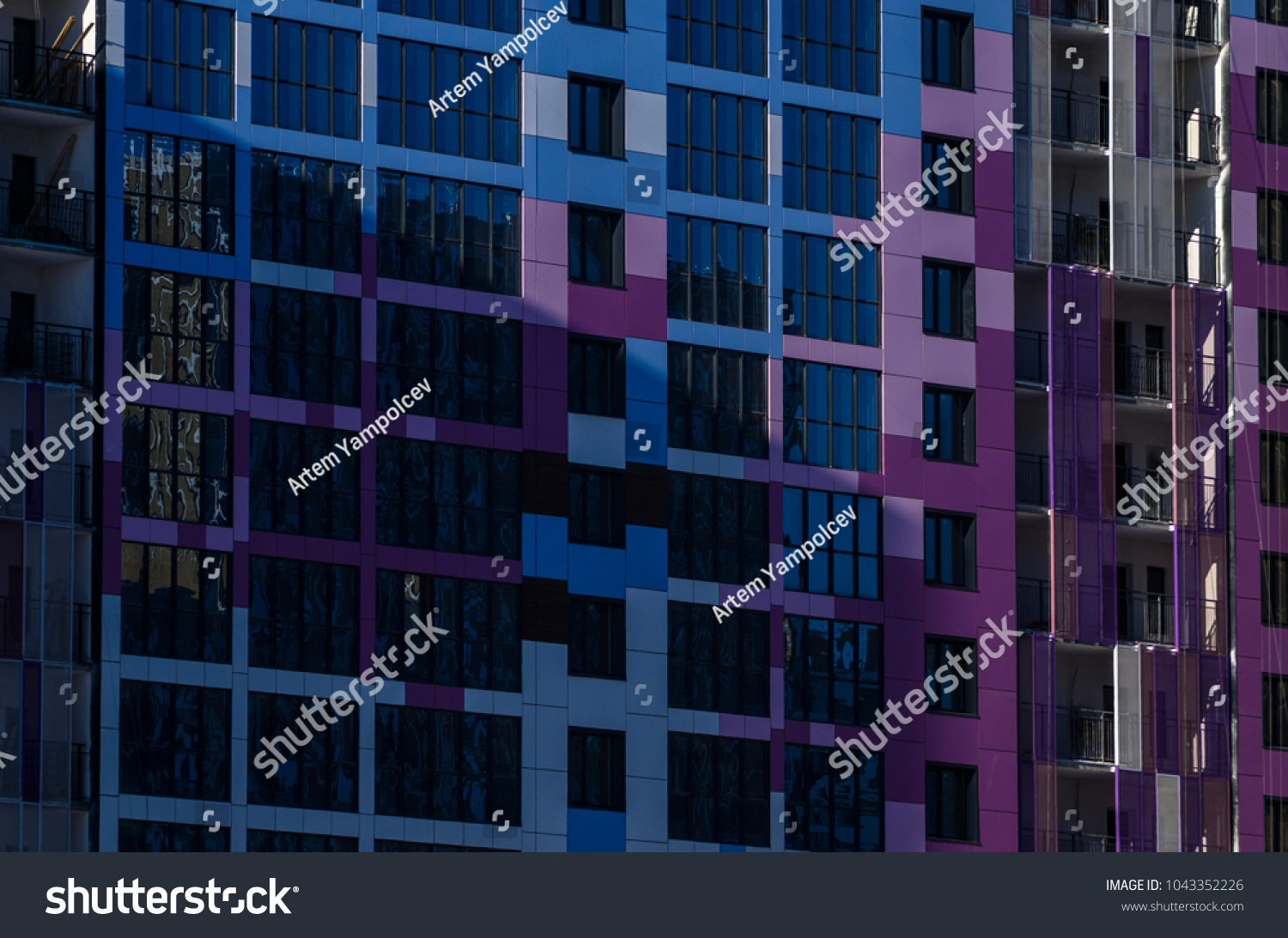 Facing the building with a ventilated facade. Aluminum colored facades. Modern facades of high-rise buildings. Construction of a large residential complex. #1043352226
