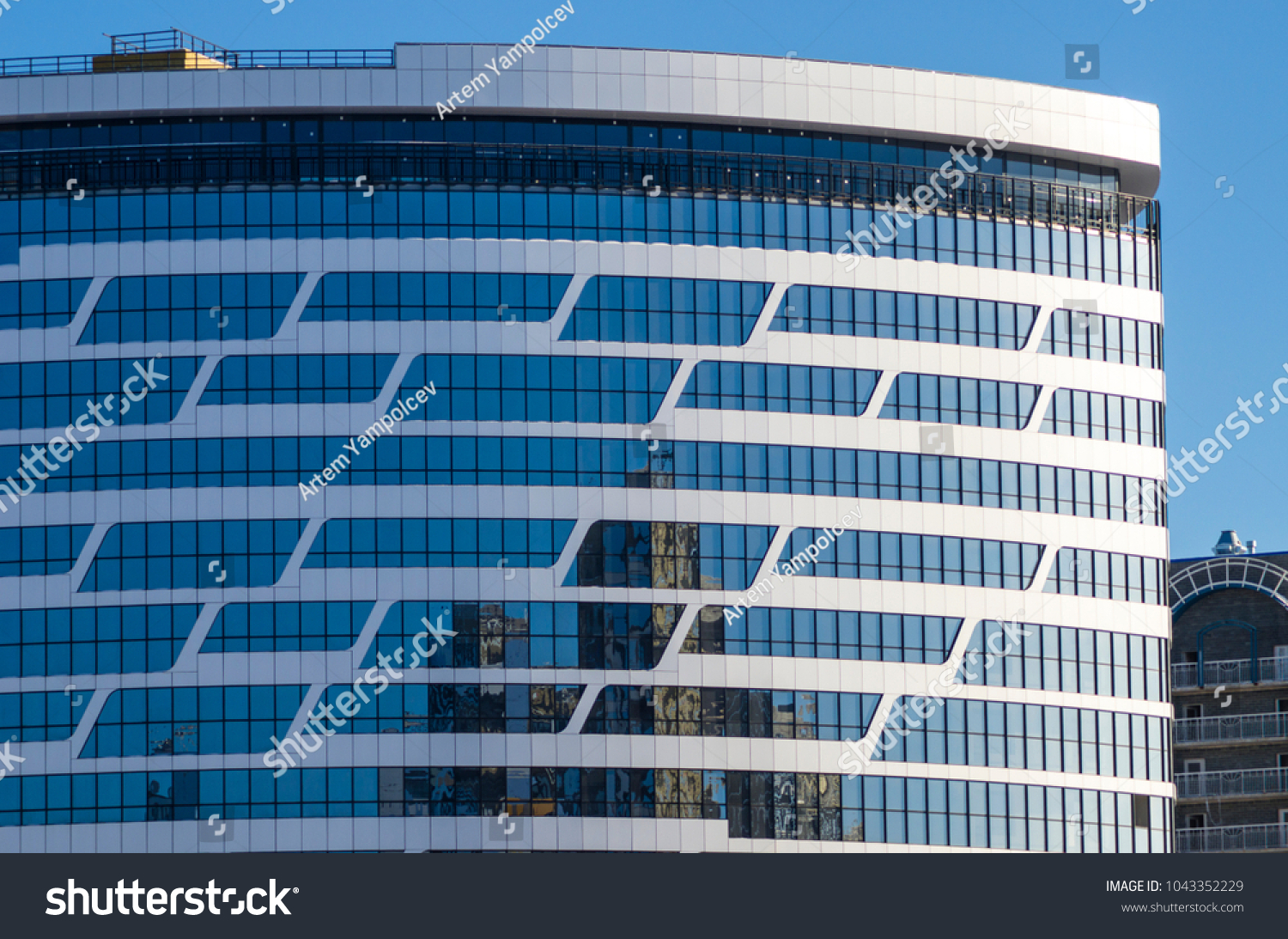 Facing the building with a ventilated facade. Aluminum colored facades. Modern facades of high-rise buildings. Construction of a large residential complex. #1043352229