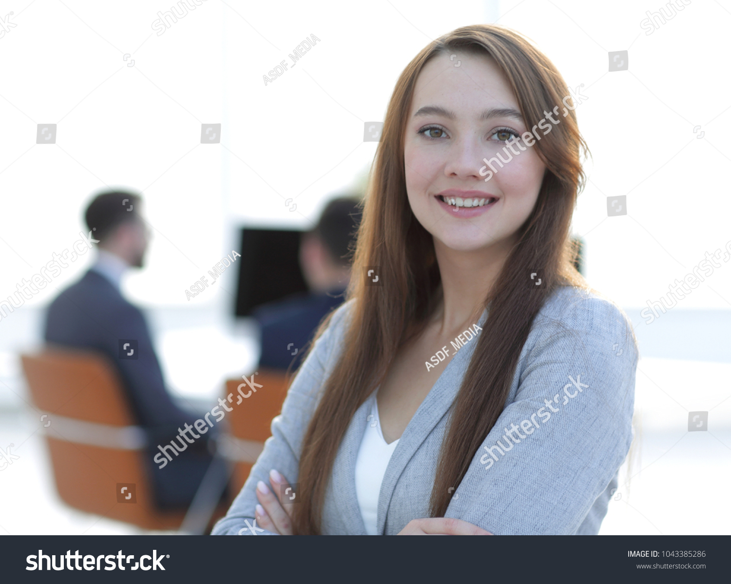 business woman on blurred background office #1043385286