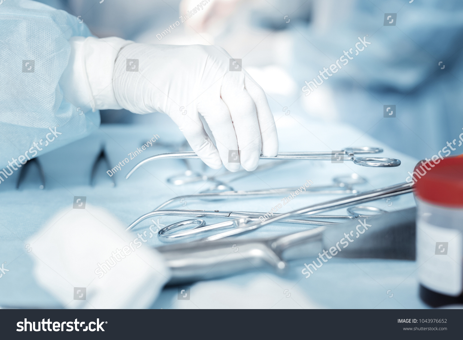 Important things. Clean useful surgical instruments being on the table and taking by a nurse. #1043976652