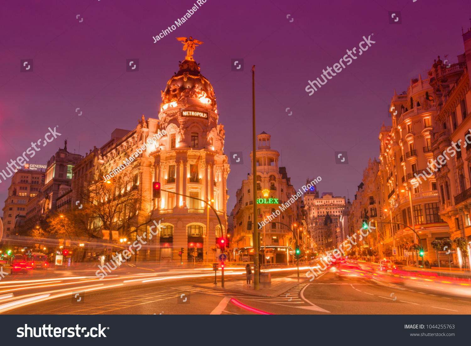 Madrid, Spain, 2018 March, 10. Gran Via Street after sunset with vehicles running through the street #1044255763