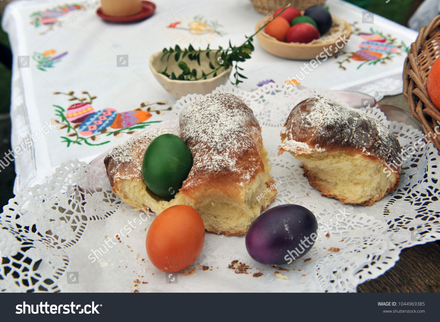 Easter traditions - colorful eggs placed in a traditional sweet bread. #1044969385