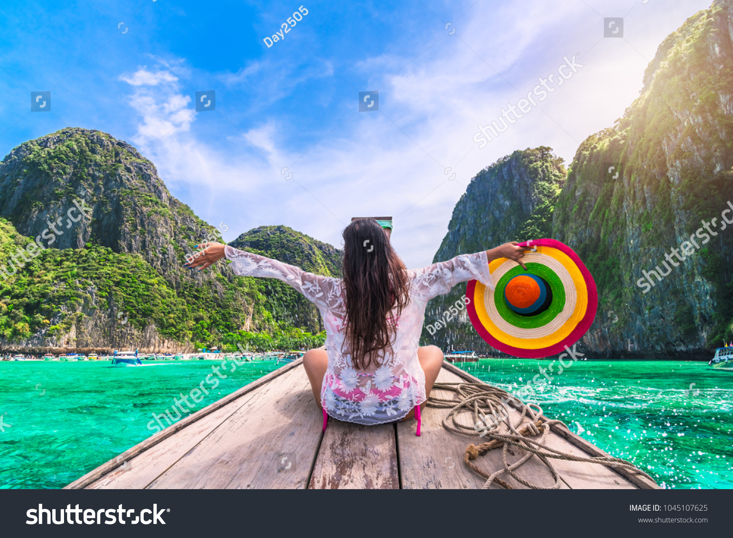 Happy traveler woman in summer dress joy fun relaxing on boat, Maya beach, Phi Phi island, Tourism Phuket, Krabi, Travel Thailand, Beautiful destination Asia, Summer holiday outdoor vacation trip #1045107625