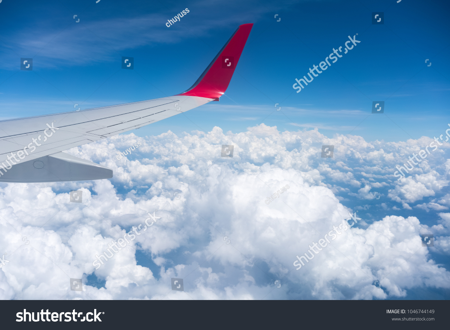 airplane wing view , travel by plane #1046744149