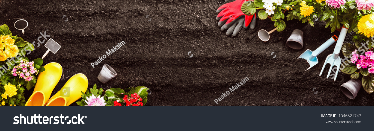 Gardening Tools on Soil Background. Spring Garden Works Concept #1046821747