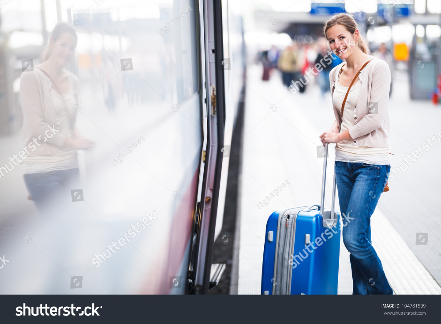 Pretty young woman boarding a train (color toned image) #104781509