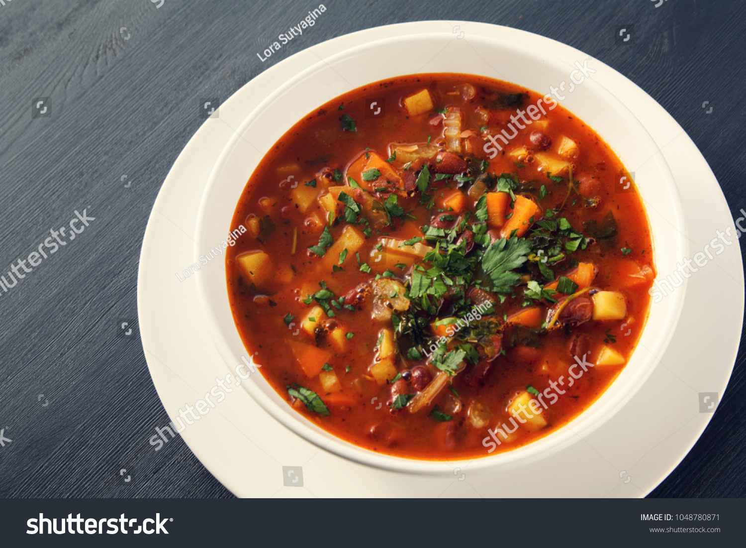 Tomato soup with red beans, potato and carrot. Vegan diet. European cuisine. Vegetarian dish. Main course. Organic meal. #1048780871