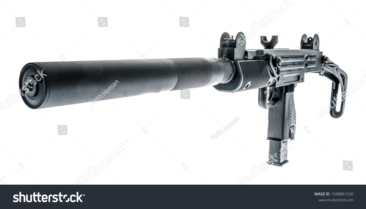 An UZI with a silencer and it's stock extended on an isolated background. #1048861526