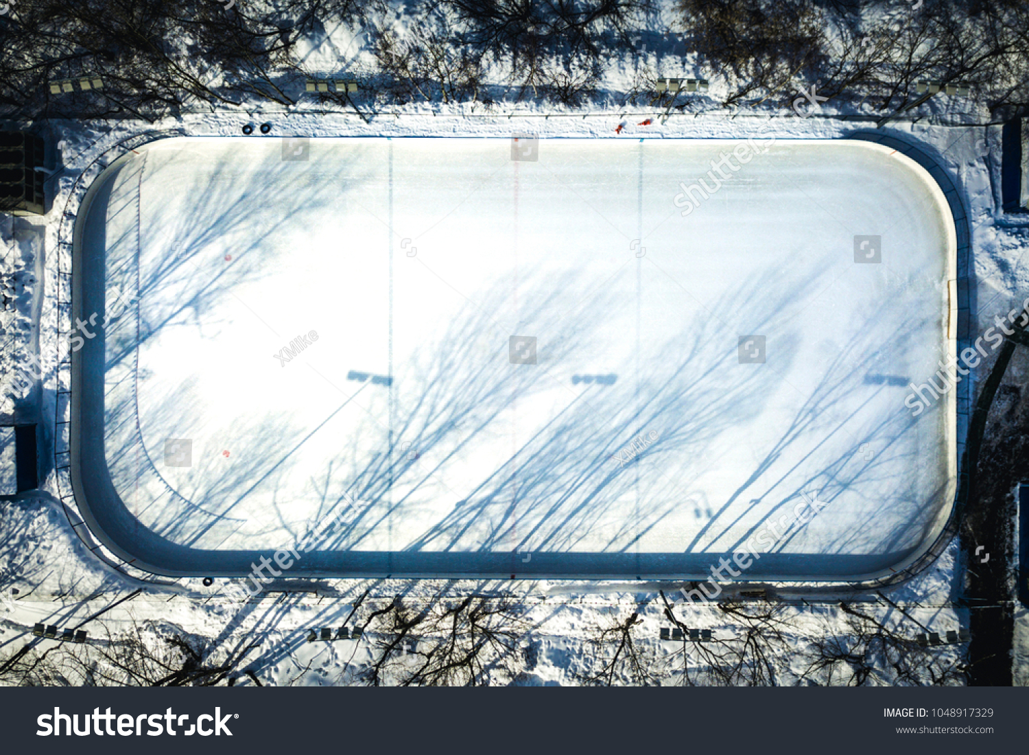 aerial view of empty hockey skate rink on a winter sunny day #1048917329