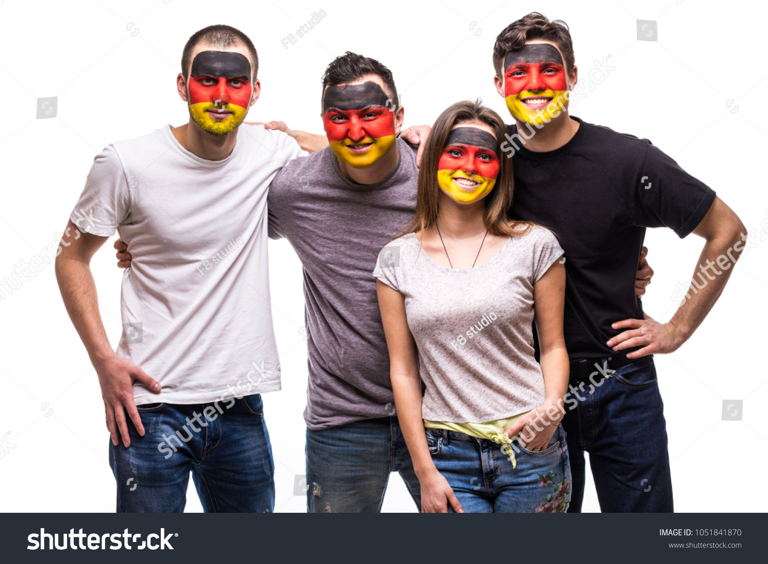 Group of people supporters fans of Germany national teams with painted flag face. Fans emotions. #1051841870