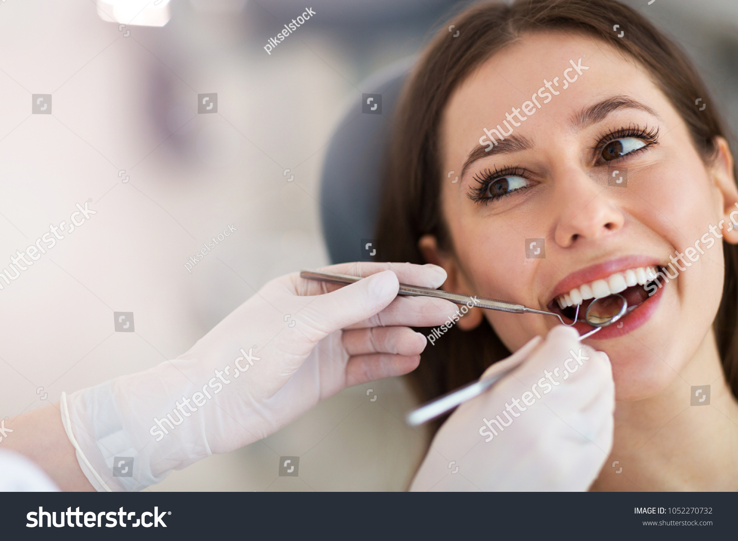 Woman having teeth examined at dentists #1052270732