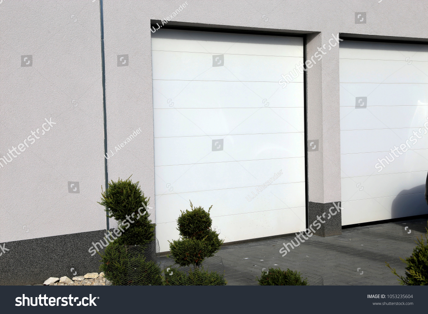 Modern white garage door (sectional door) #1053235604