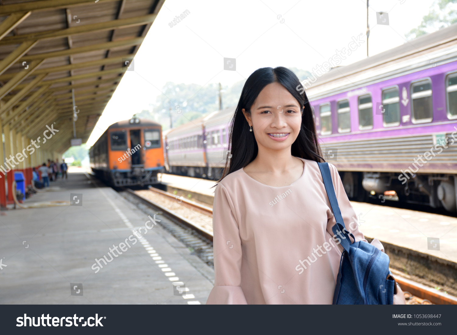 Asian woman  train station background #1053698447