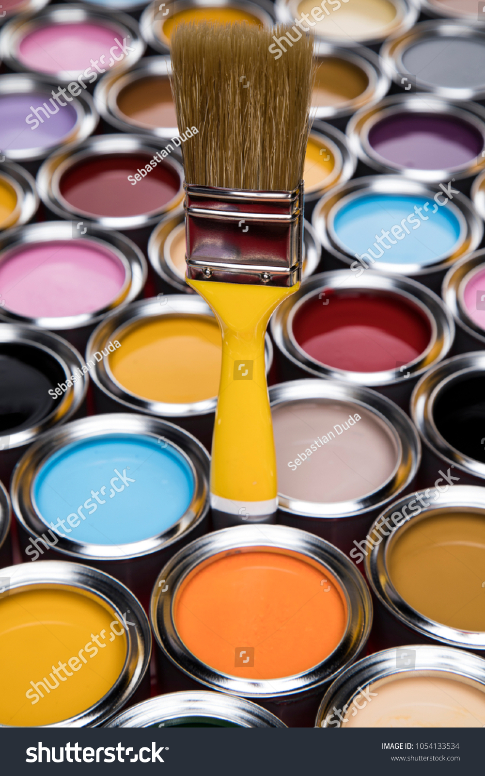Tin metal cans with color paint and paintbrush #1054133534
