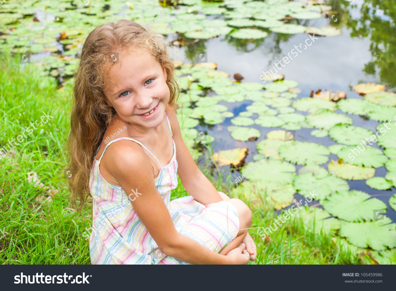 happy child near a pond #105459986