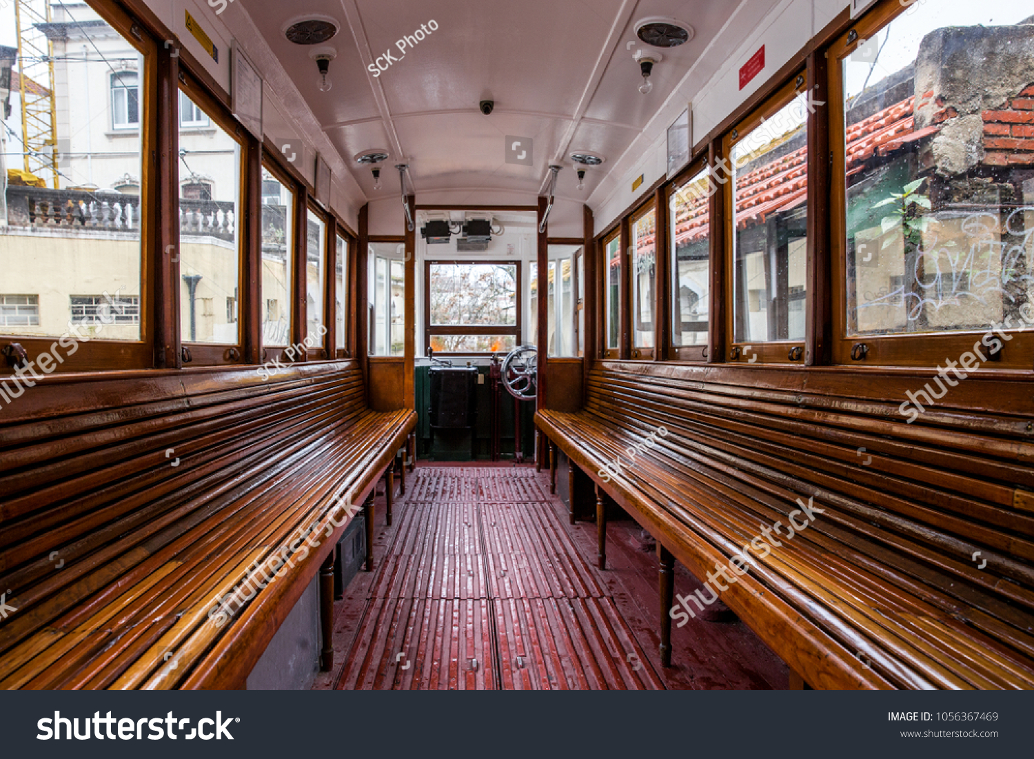 Wooden bench inside a tramway in Lisbon. #1056367469