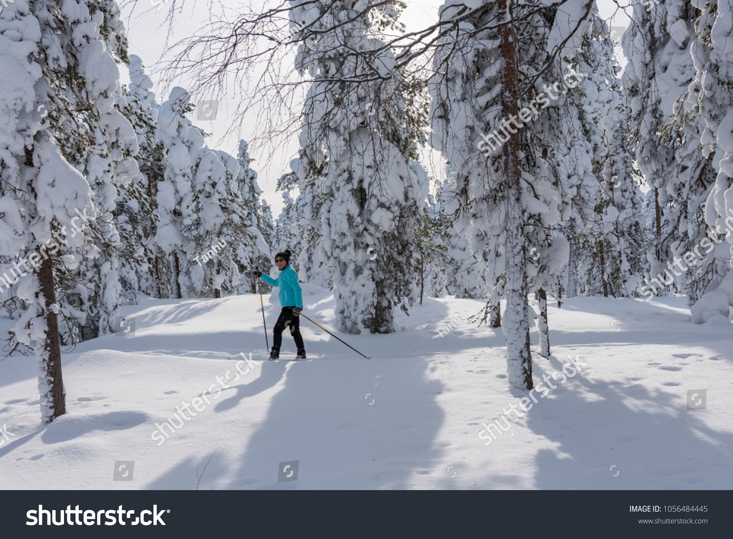 Woman cross country skiing in Lapland Finland #1056484445