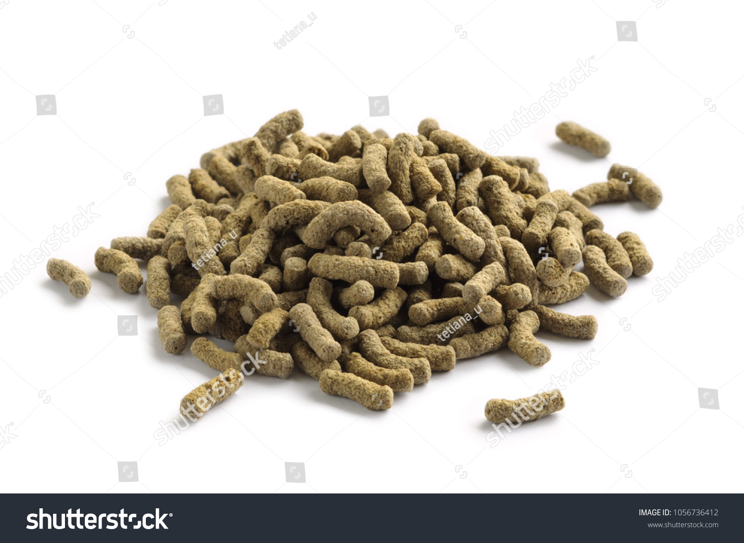 Fish feed isolated on white background. Fish food in sticks for large aquarium and pond fish #1056736412