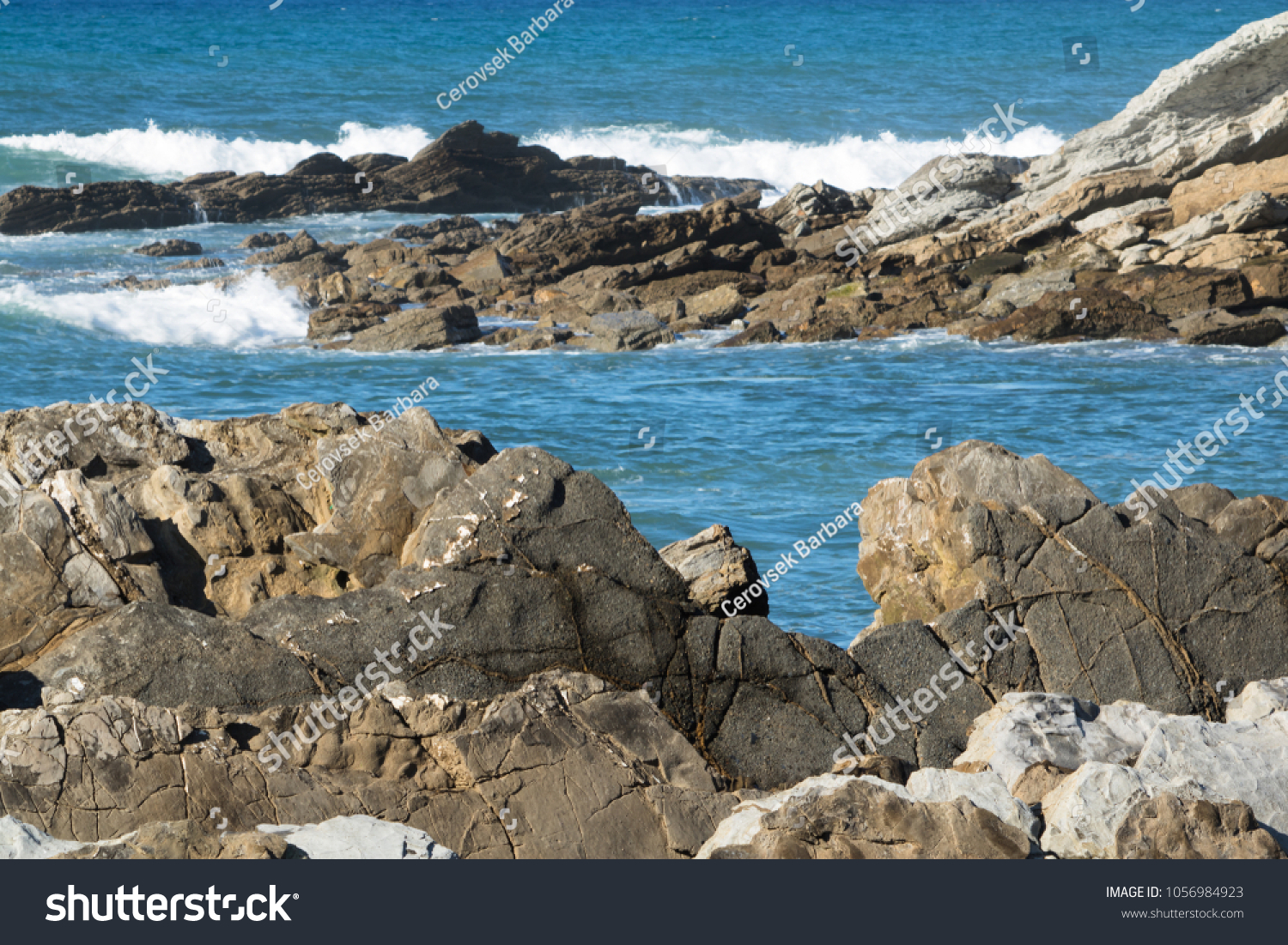close up on powerful breaking waves of atlantic ocean against rocks, hendaye, basque country, france #1056984923