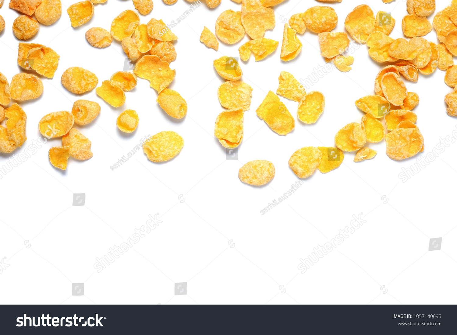 Scattered cornflakes isolated on white. Top view. #1057140695