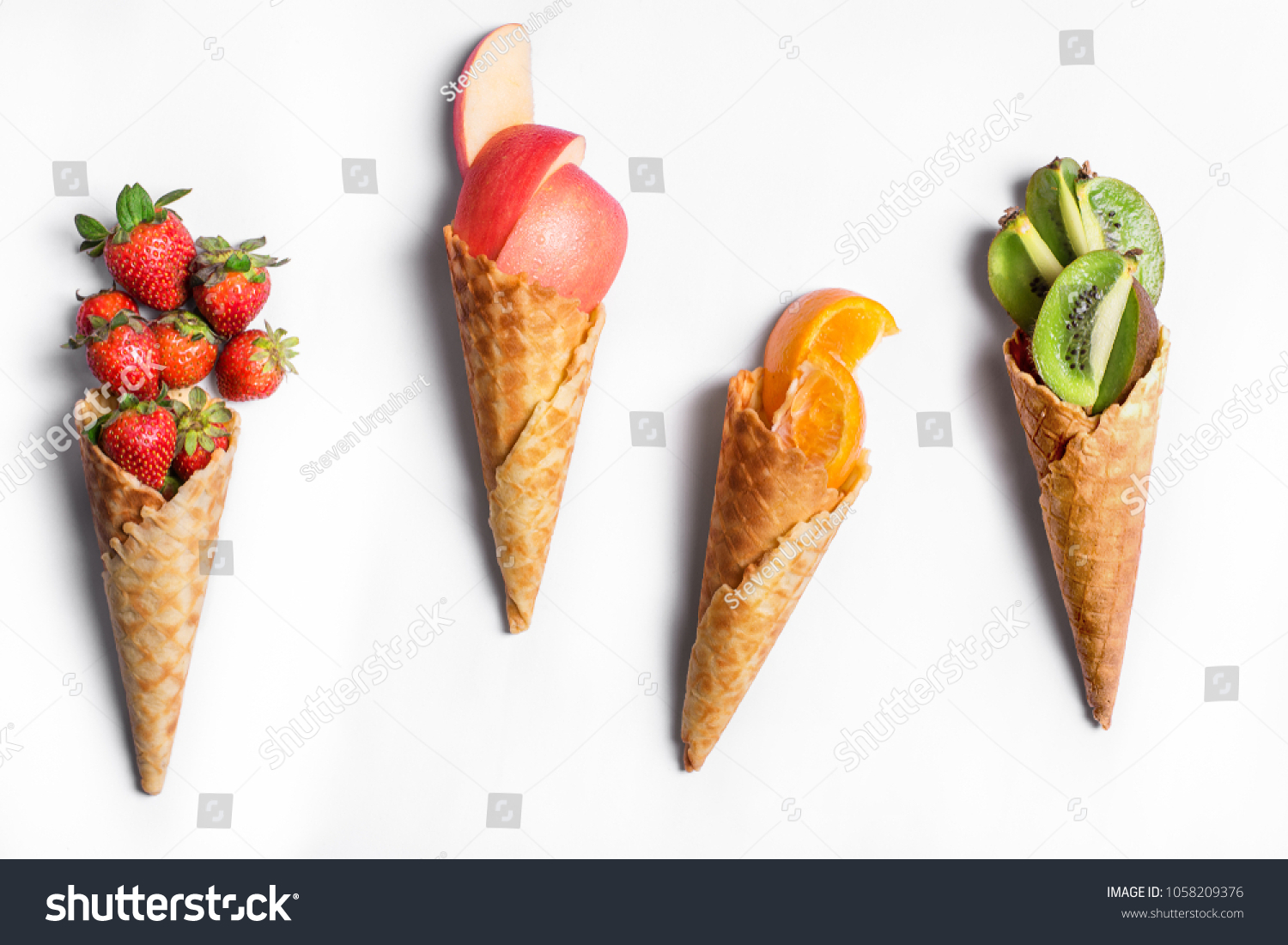 Fruit in waffle cones isolated on white background - healthy ice cream options. #1058209376