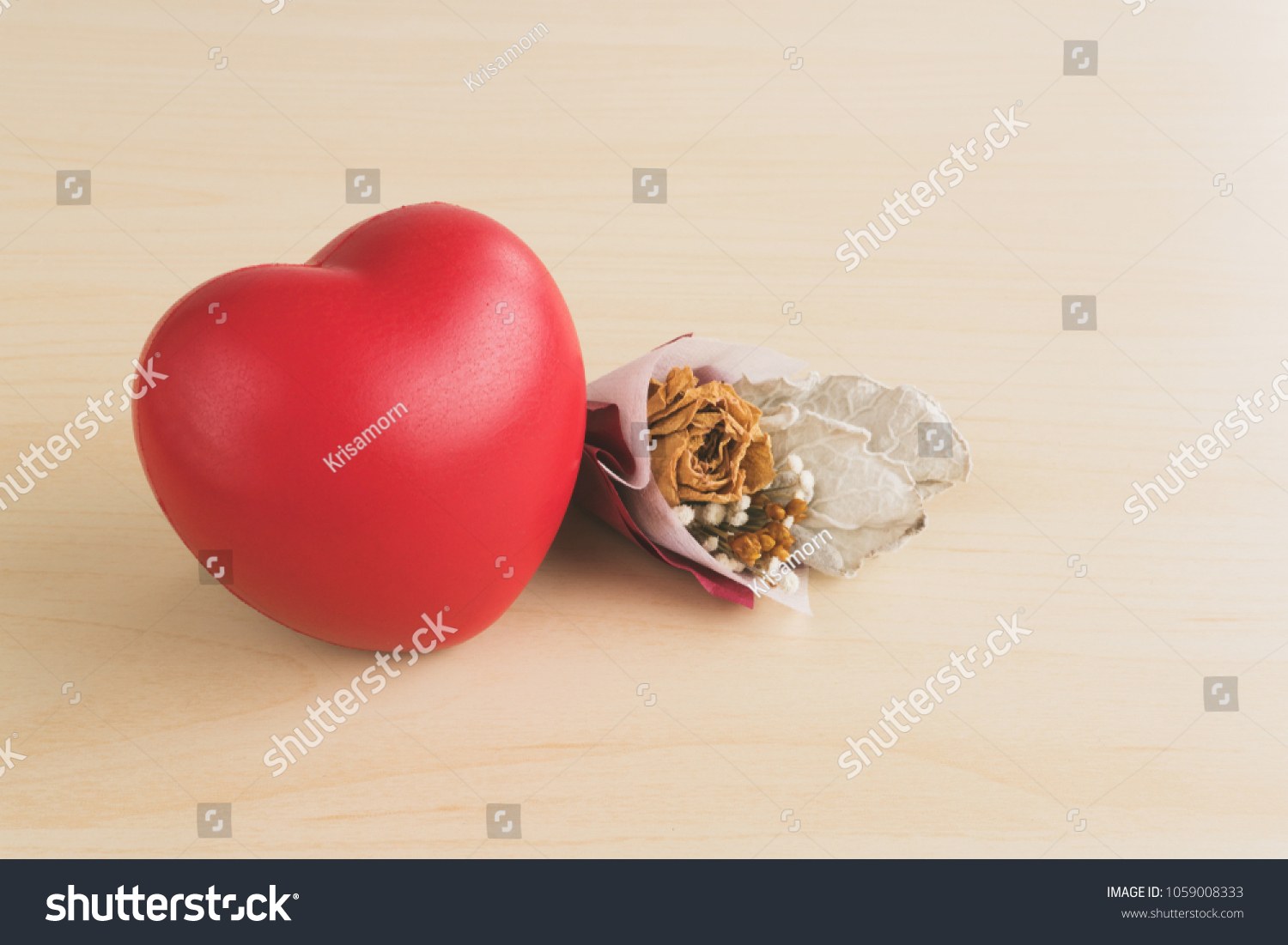 Red love heart and dried flower bouquet on wood table #1059008333