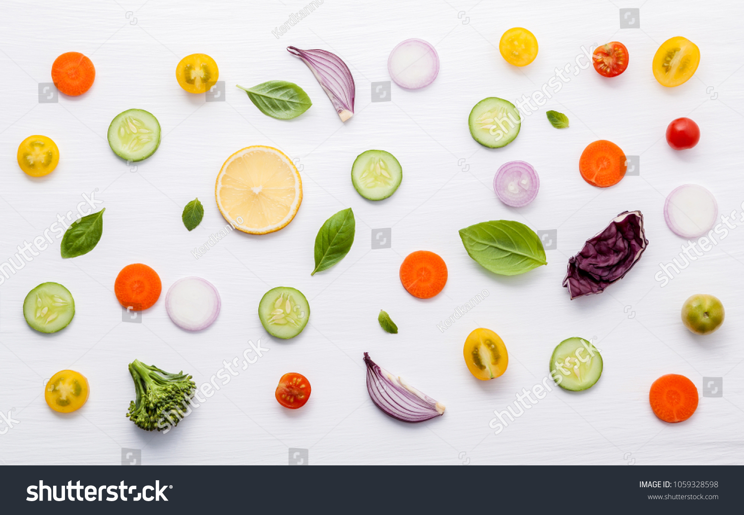 Food pattern with raw ingredients of salad. Various vegetables lettuce leaves, cucumbers, tomatoes, carrots, broccoli, onion and lemon flat lay on white background. #1059328598
