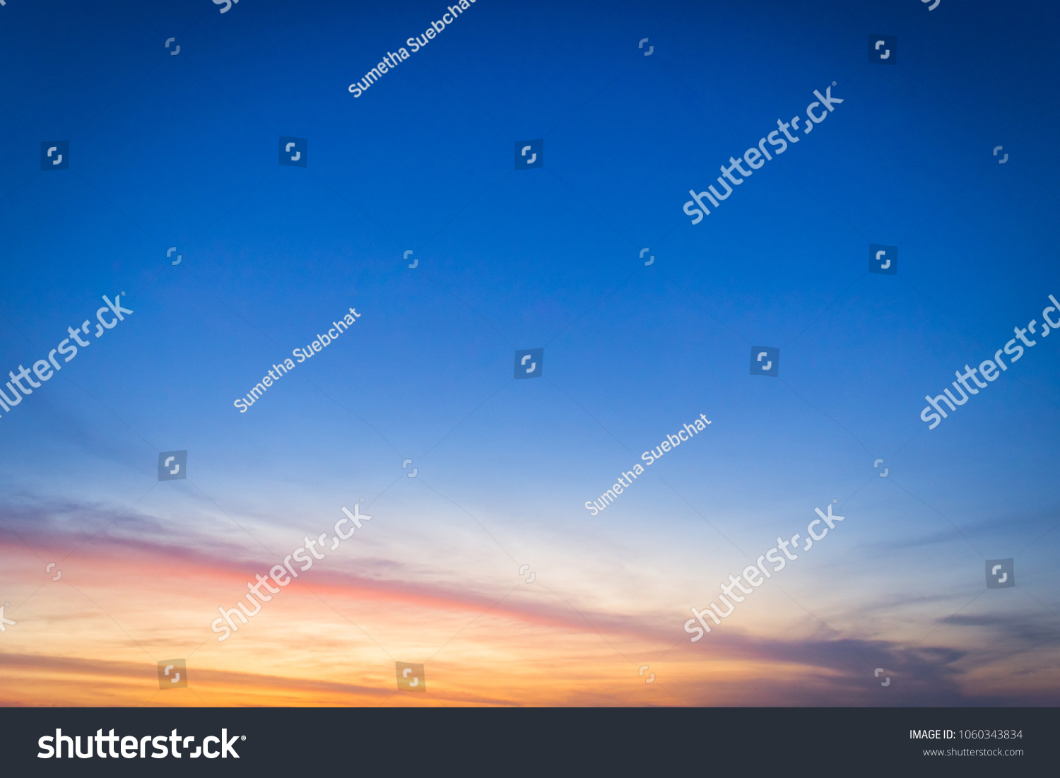 Dusk sky on twilight in the evening,majestic sunset with dramatic sunlight on dark blue sky on summer season,idyllic peaceful nature background.  #1060343834
