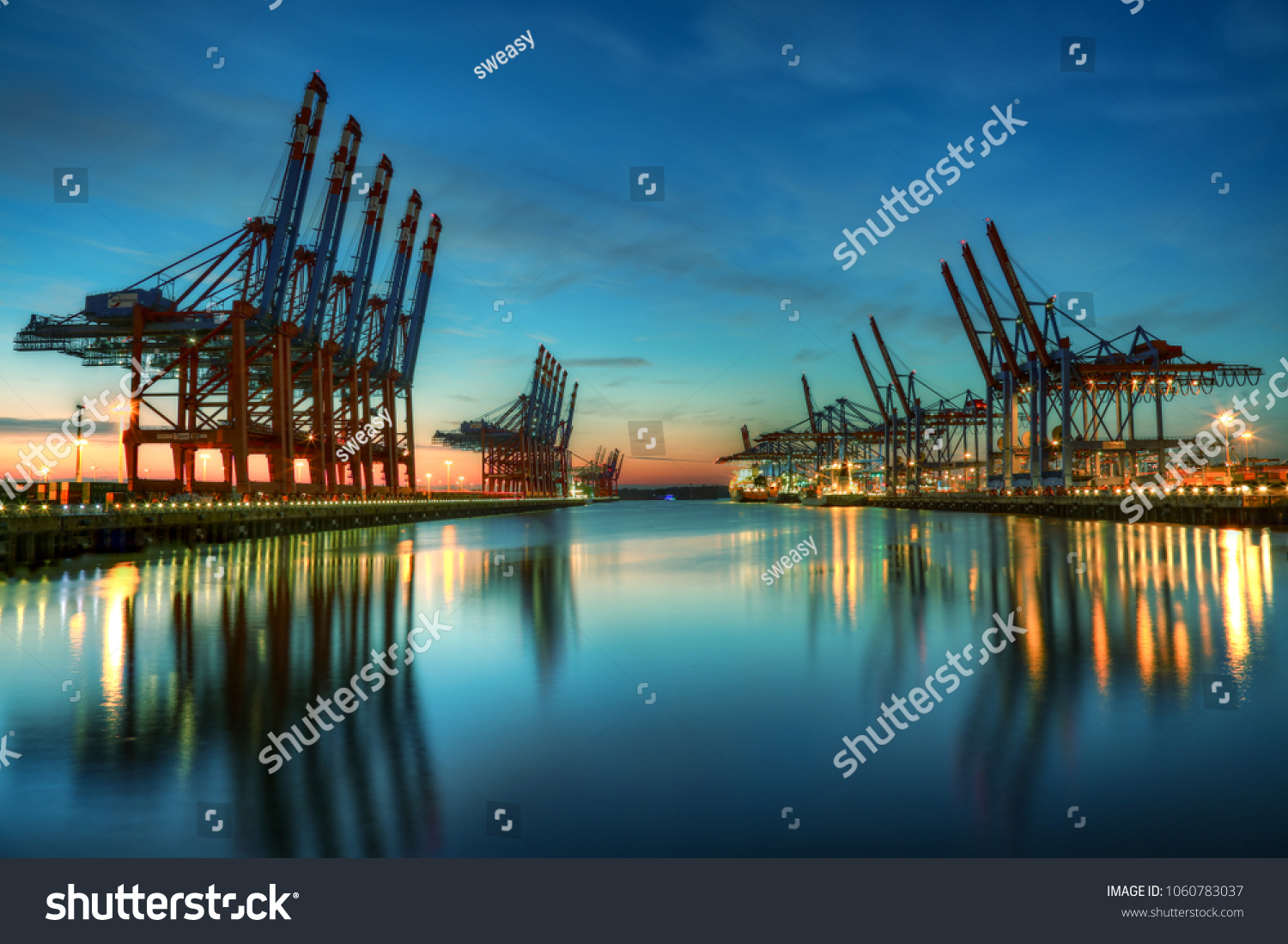 Container terminal Burchardkai in the port of Hamburg during blue hour #1060783037