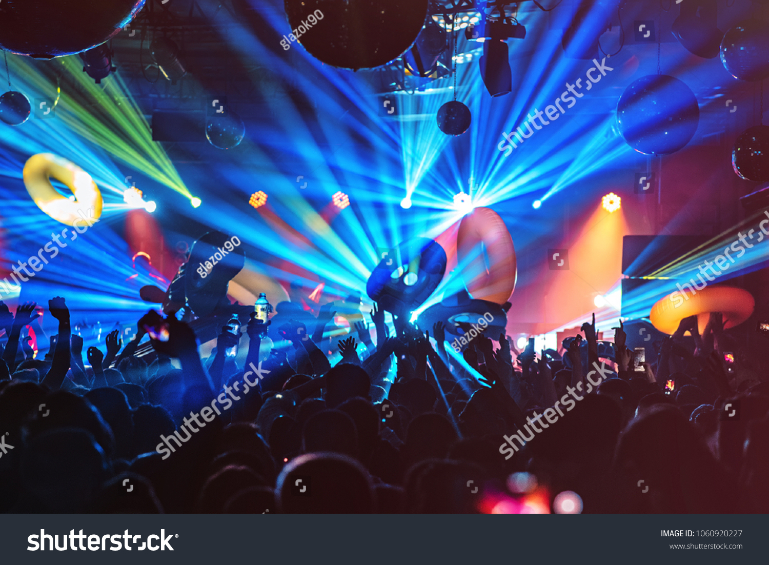 dj night club party rave with crowd in music festive #1060920227