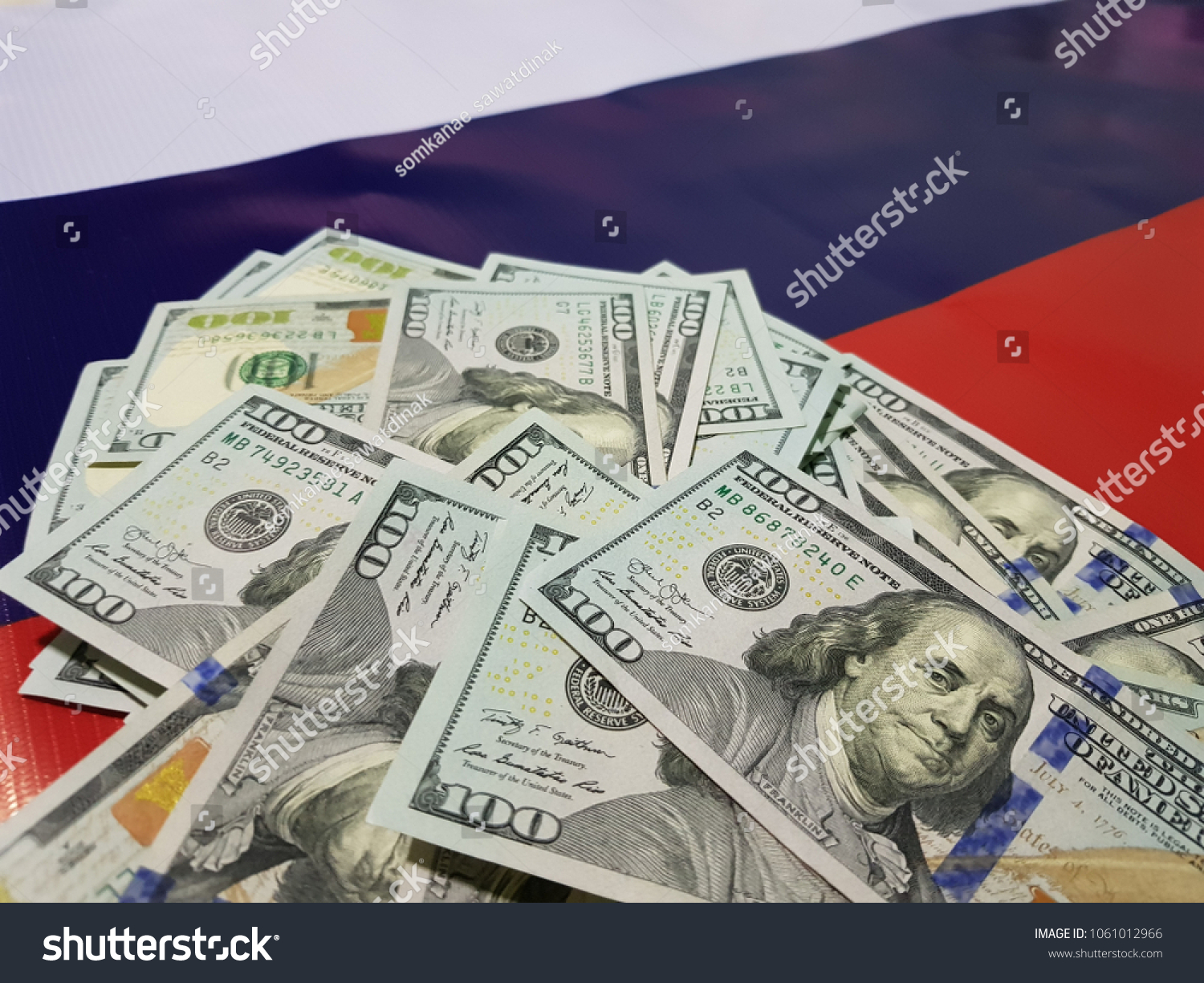 Dollar falls on the Russian flag and cyber security concept #1061012966