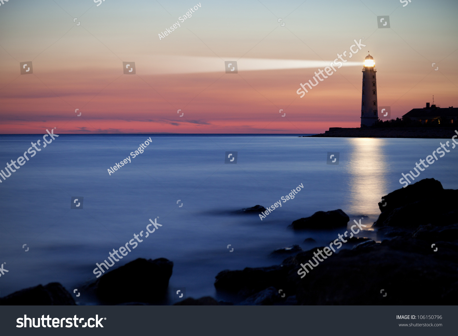Seascape at sunset. Lighthouse on the coast #106150796