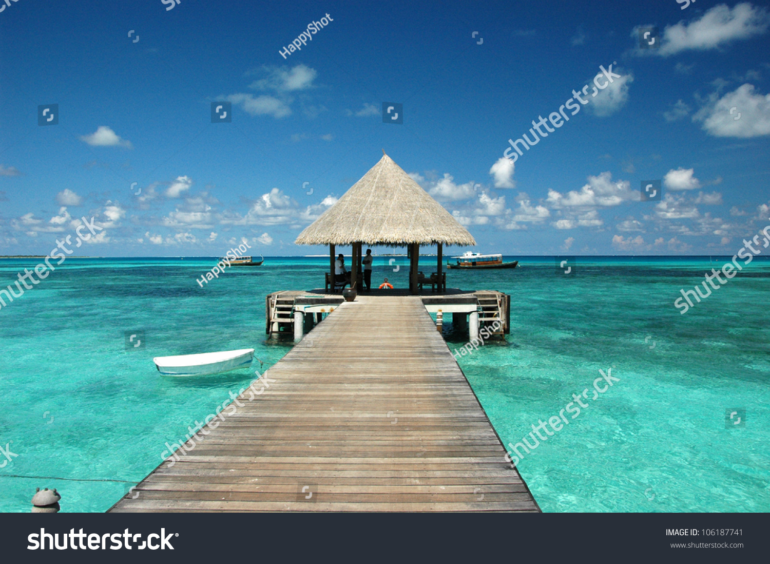Wooden wharf with pavilion for ships at Maldives #106187741