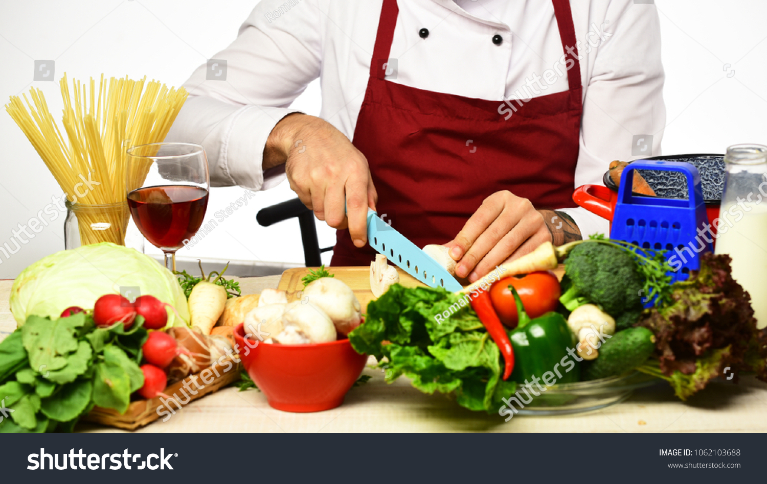 Chef cooking food cutting mushroom. Meal preparation concept. Hands hold knife preparing vegetables #1062103688