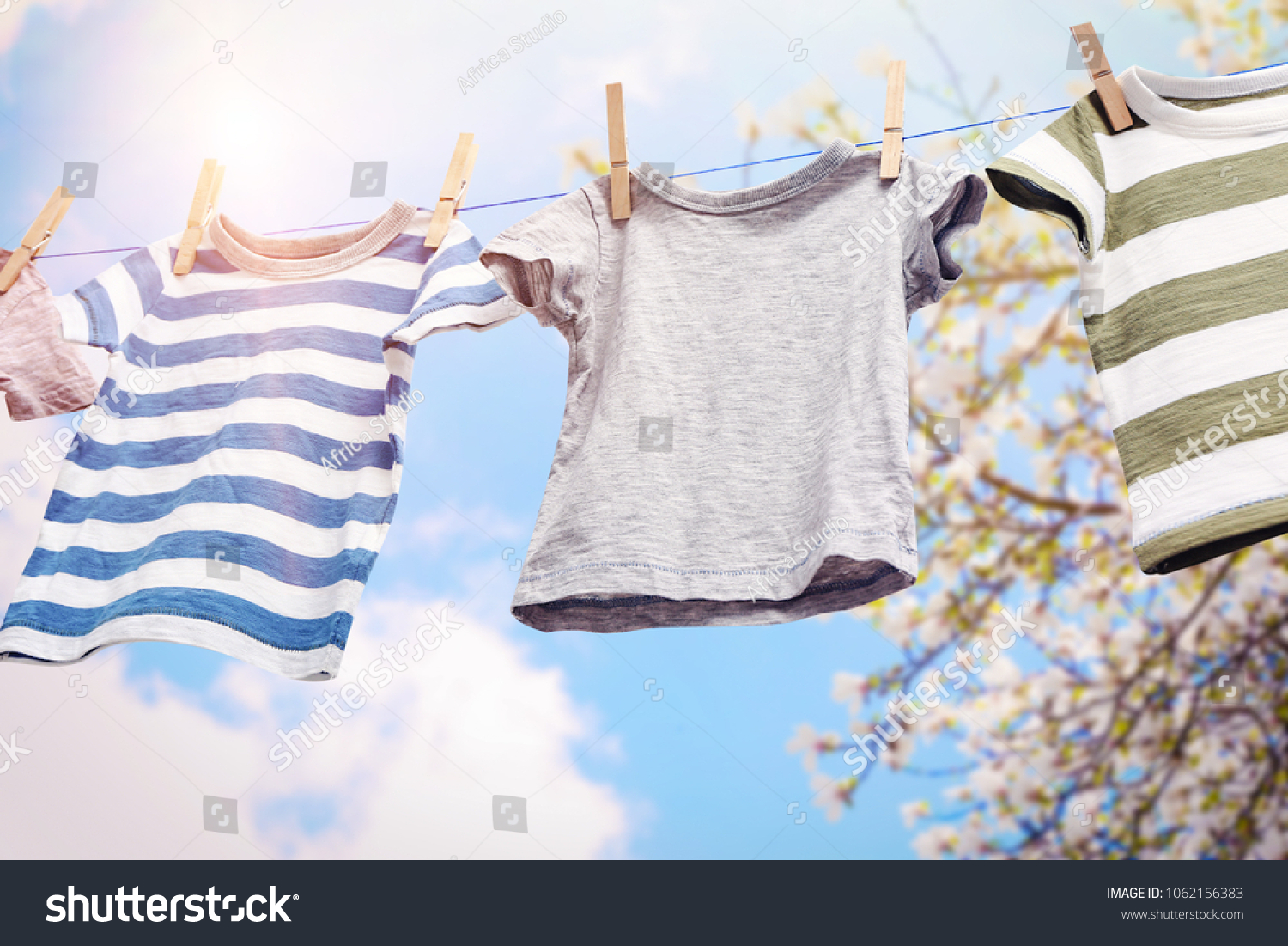 Rope with clean clothes outdoors on laundry day #1062156383